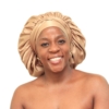Woman wearing oversized soft gold satin bonnet for overnight natural hair protection.